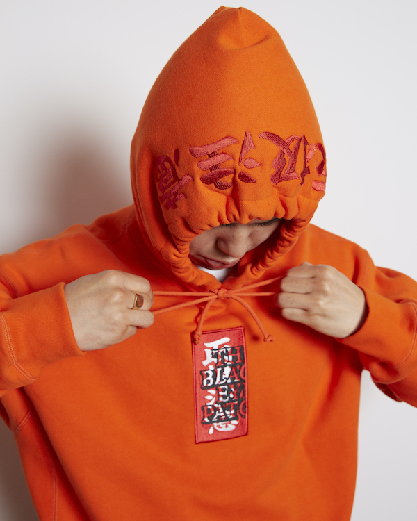 BLACK EYE PATCH HANDLE WITH CARE LABEL HOODIE 入荷 - BOOMERANG