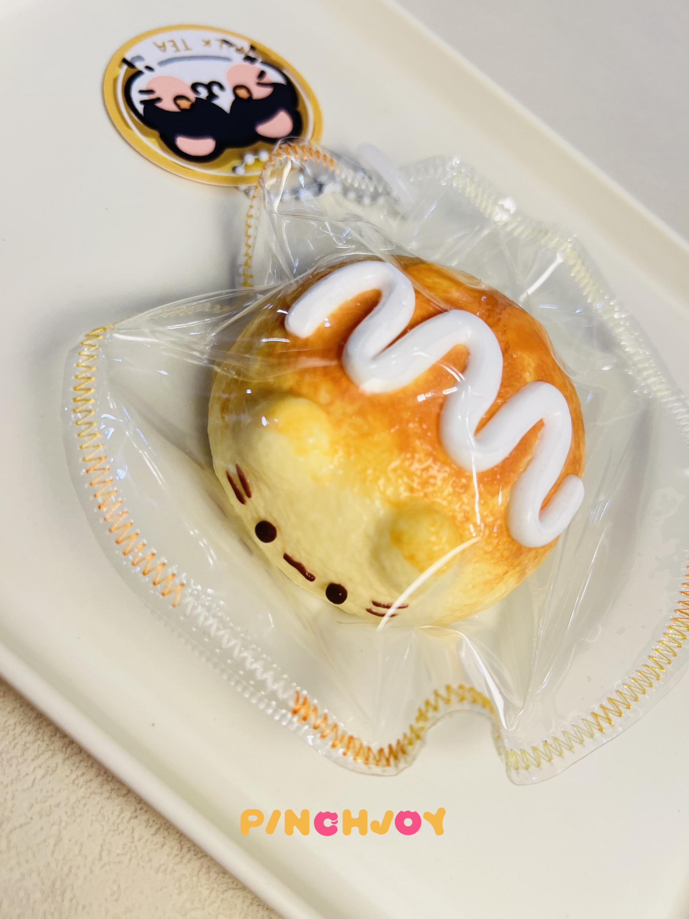 愛らしい猫パンのスクイーズおもちゃ、柔らかいパイナップルパンの