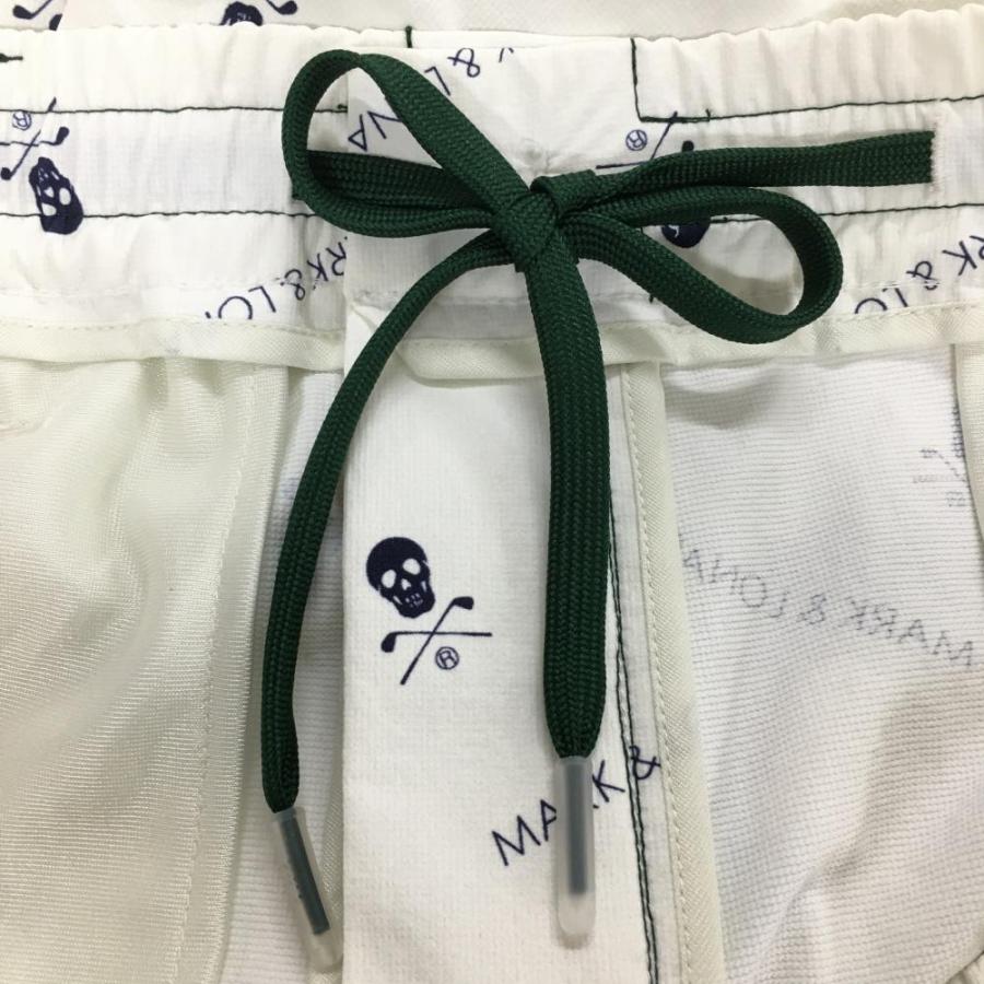 新品】マークアンドロナ パンツ 白×ネイビー スカル・ロゴ総柄 裾