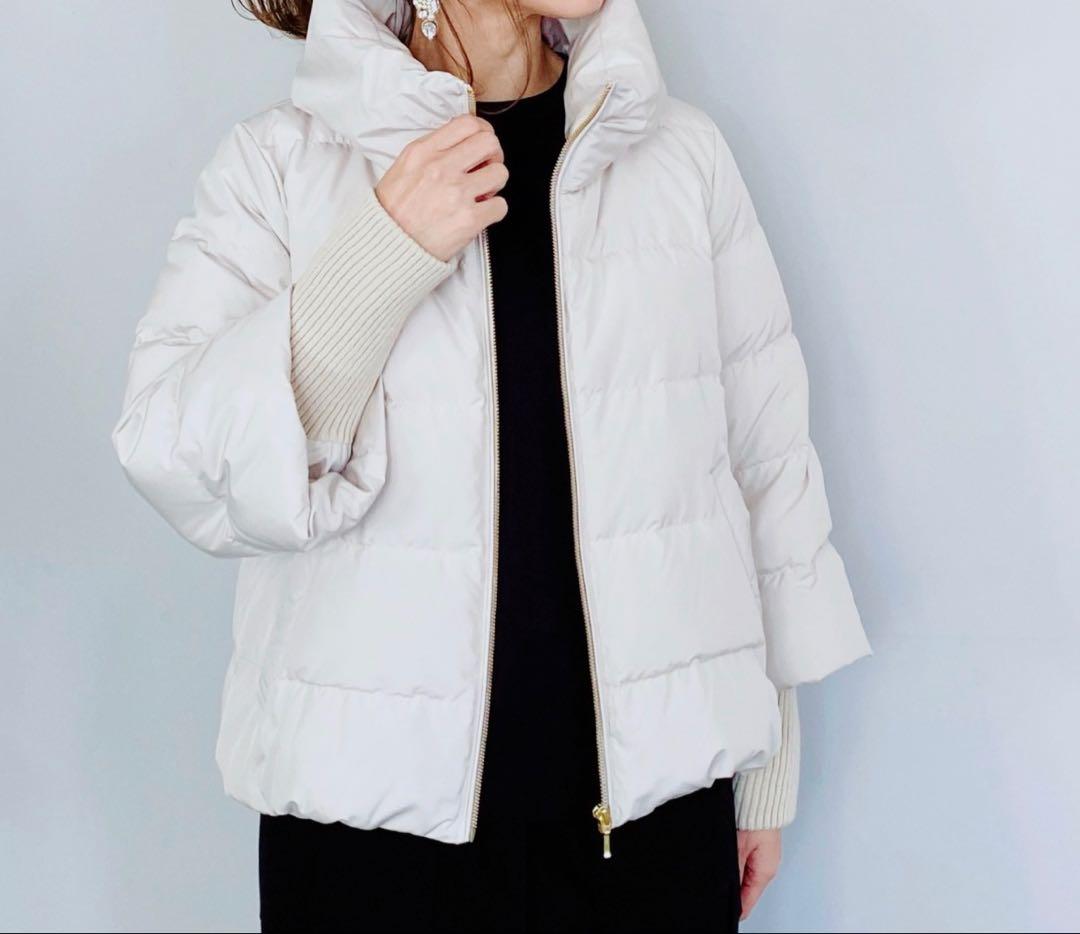 フード付きライトベージュダウンジャケット ナンガのメンズ＆ウィメンズダウンジャケット、防水透湿素材や難燃素材