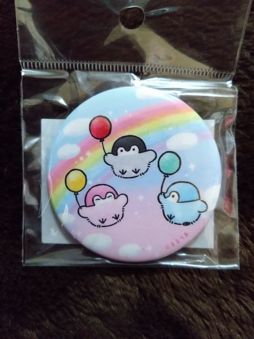 コウペンちゃん 虹がかかる缶バッジ コウペンちゃん 虹がかかるハンドタオル（虹の小島） – コウペンちゃん